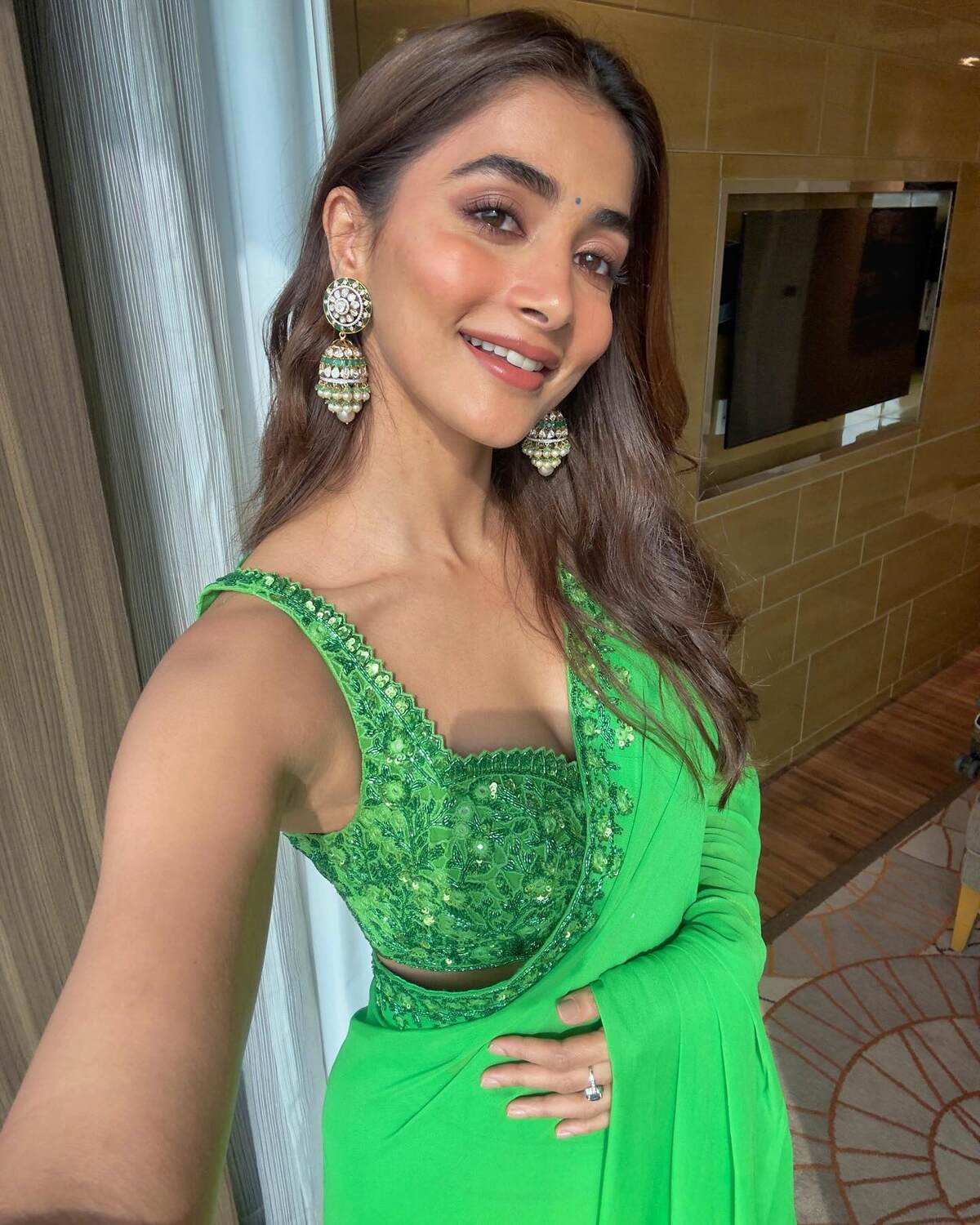 Pooja hegde in green saree clicks